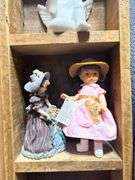 Collectible Figurines in Wooden Display Case