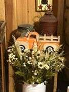 Rustic Home Decor Assortment with Toy Trucks, Floral Accents, and Candles