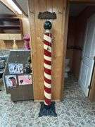 Decorative Barber Pole with 'Haircut & Shave' Signage