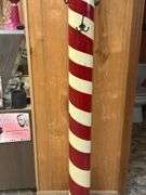 Decorative Barber Pole with 'Haircut & Shave' Signage