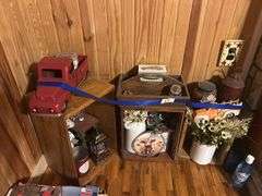Rustic Home Decor Assortment with Toy Trucks, Floral Accents, and Candles