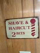 Decorative Barber Pole with 'Haircut & Shave' Signage