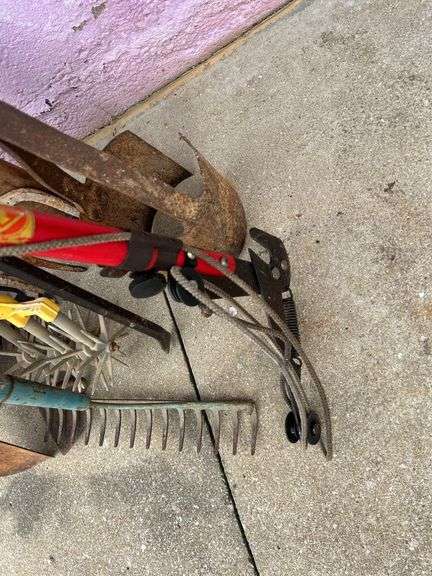 Collection of Garden Tools: Shovels, Rakes, and More