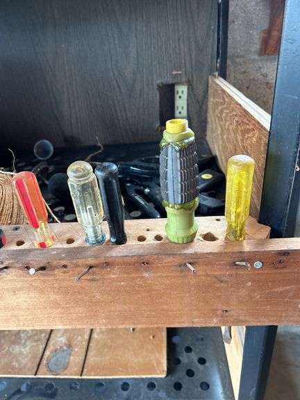 Tool Storage Shelf with Assorted Tools and Supplies