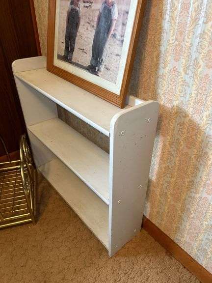 Framed Print, White Shelf, Stool, and Magazine Rack
