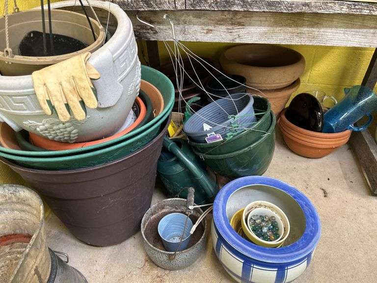 Variety of Assorted Flower Pots and Gardening Items image
