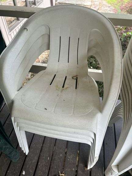 Stack of 4 White Plastic Outdoor Chairs image