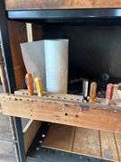 Tool Storage Shelf with Assorted Tools and Supplies