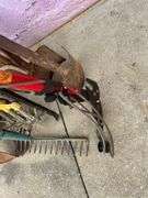 Collection of Garden Tools: Shovels, Rakes, and More