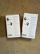 Two Plantronics Voyager Legend Bluetooth Headsets