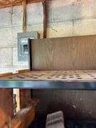 Tool Storage Shelf with Assorted Tools and Supplies