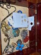 Jewelry Lot with Red Jewelry Box, Brooches, Earrings, and Religious Pins