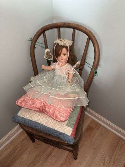 Collectable Doll on Child's Chair with Pillows image