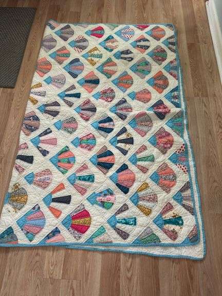 Handmade Fan Quilt with Multi-Colored Fabric Designs image