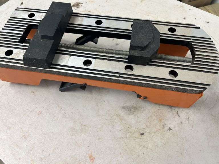 Orange and Silver Colored Vise