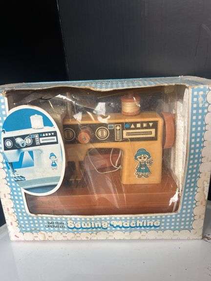 Toy Sewing Machine, Fisher Price Clock, and Bead Toy