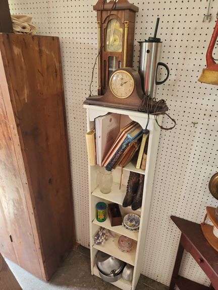 Shelf with Various Items: Clocks, Books, Decor, and More image