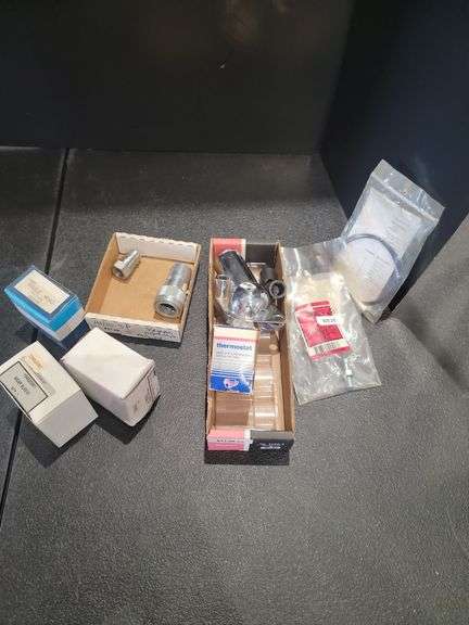 Assorted Vehicle Parts, Including Thermostat and Wear Sleeve image