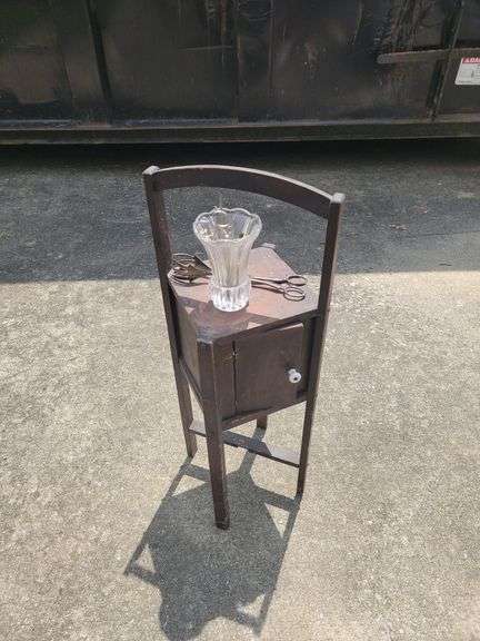 Small Wooden Table with Glass Vase and Tongs image