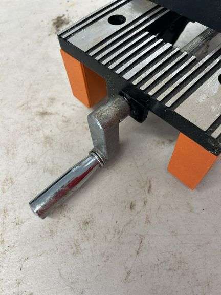 Orange and Silver Colored Vise