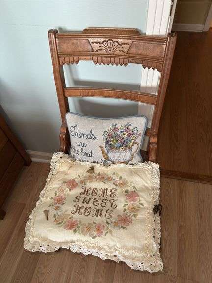 Ornate Wooden Chair with Decorative Throw Pillows image