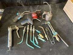 Assorted Tools: Grease Gun, Torches, and Oil Cans