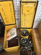 Two Yellow Ammo Boxes with Hole Saw Blades and Porter-Cable Sanding Discs