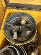 Two Yellow Ammo Boxes with Hole Saw Blades and Porter-Cable Sanding Discs
