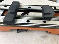 Orange and Silver Colored Vise