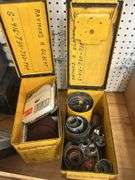 Two Yellow Ammo Boxes with Hole Saw Blades and Porter-Cable Sanding Discs