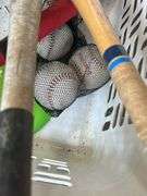 Basket of Sports Equipment: Bats, Tennis Racket, Baseballs, & More