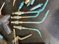 Assorted Tools: Grease Gun, Torches, and Oil Cans