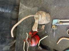 Assorted Tools: Grease Gun, Torches, and Oil Cans