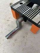 Orange and Silver Colored Vise