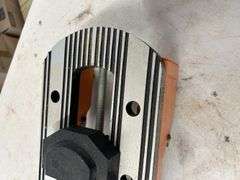 Orange and Silver Colored Vise