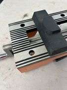 Orange and Silver Colored Vise