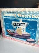 Toy Sewing Machine, Fisher Price Clock, and Bead Toy