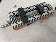Orange and Silver Colored Vise