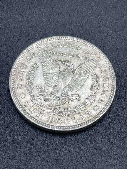 FIVE MORGAN SILVER DOLLARS