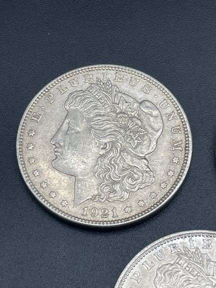 FIVE MORGAN SILVER DOLLARS