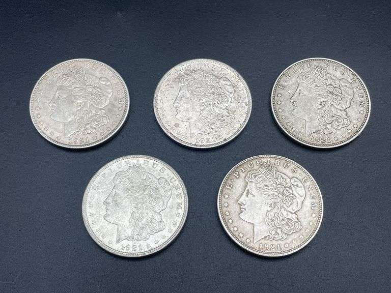 FIVE MORGAN SILVER DOLLARS