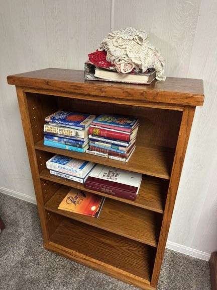 Wooden Bookcase with Books and Crochet image