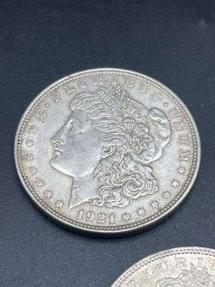 FIVE MORGAN SILVER DOLLARS