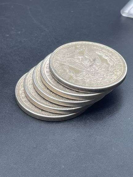 FIVE MORGAN SILVER DOLLARS