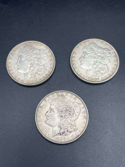 THREE MORGAN SILVER DOLLARS