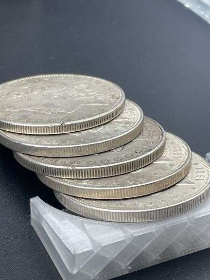 FIVE MORGAN SILVER DOLLARS