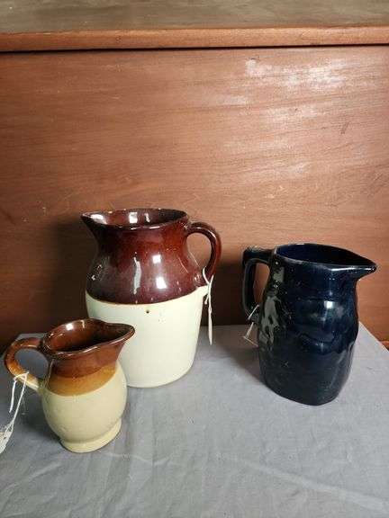 Collection of Three Stoneware Pitchers image
