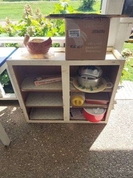 Cabinet with Contents: Cookware, Cutlery, Planter image