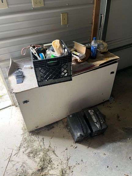 Assorted Items on a Stand with Batteries and Storage image
