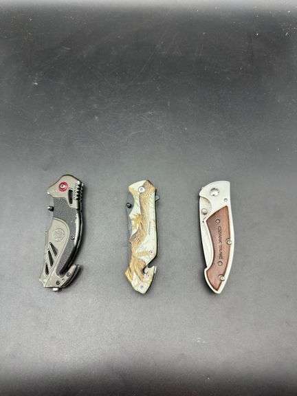 Three Pocket Knives: Smith & Wesson, Ozark Trail, and Tac-Force